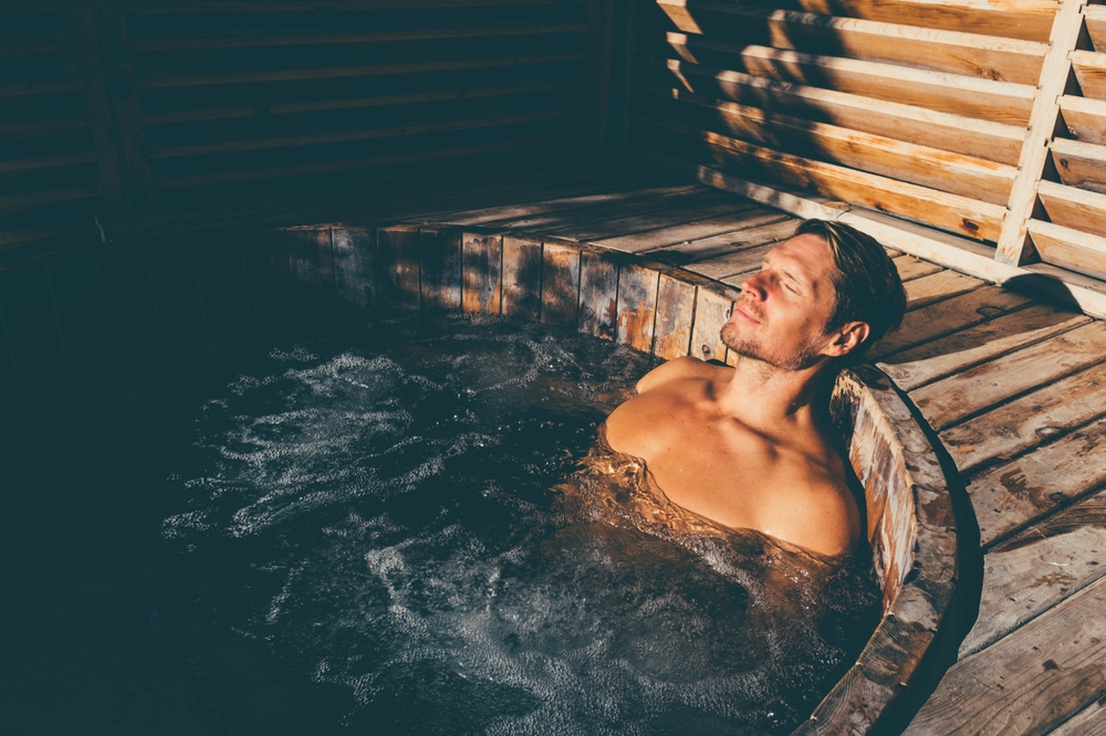 Man,Relaxing,In,Wooden,Hot,Tub,Outdoor.
