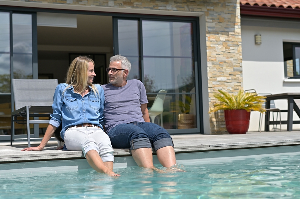 Middle aged,Couple,Enjoying,Time,By,Private,Pool